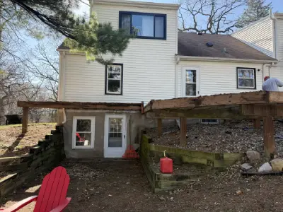 Deck boards removed during Chanhassen deck demolition showing exposed framing
