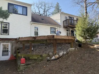 Exposed old deck joists and framing during Chanhassen deck replacement