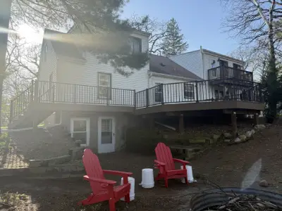 Finished composite deck surface with black aluminum railings in Chanhassen
