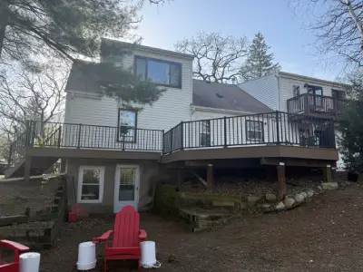 Wide backyard view of completed elevated composite deck in Chanhassen