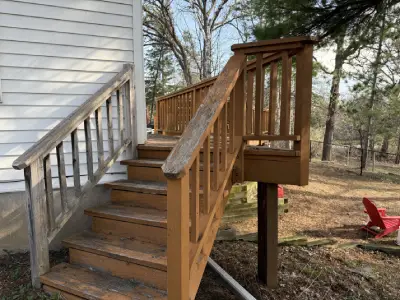 Old deck stairs and worn wood railings before replacement in Chanhassen