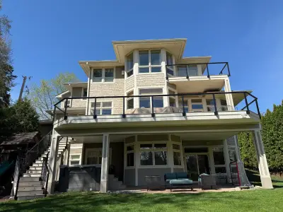 Wide view of a completed Edina deck extension and TimberTech composite resurfacing project with new railings