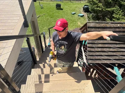 Danny installing railing details on an Edina deck extension and resurfacing project