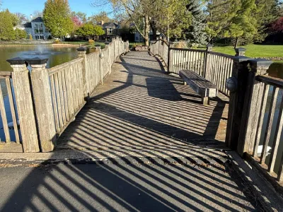 Inspection work on a Hopkins community bridge before new decking installation