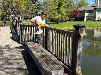 Structural reinforcement work on a Hopkins community bridge before new decking