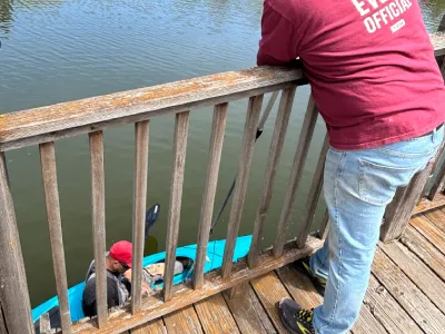 Old bridge decking being removed during community bridge redecking work