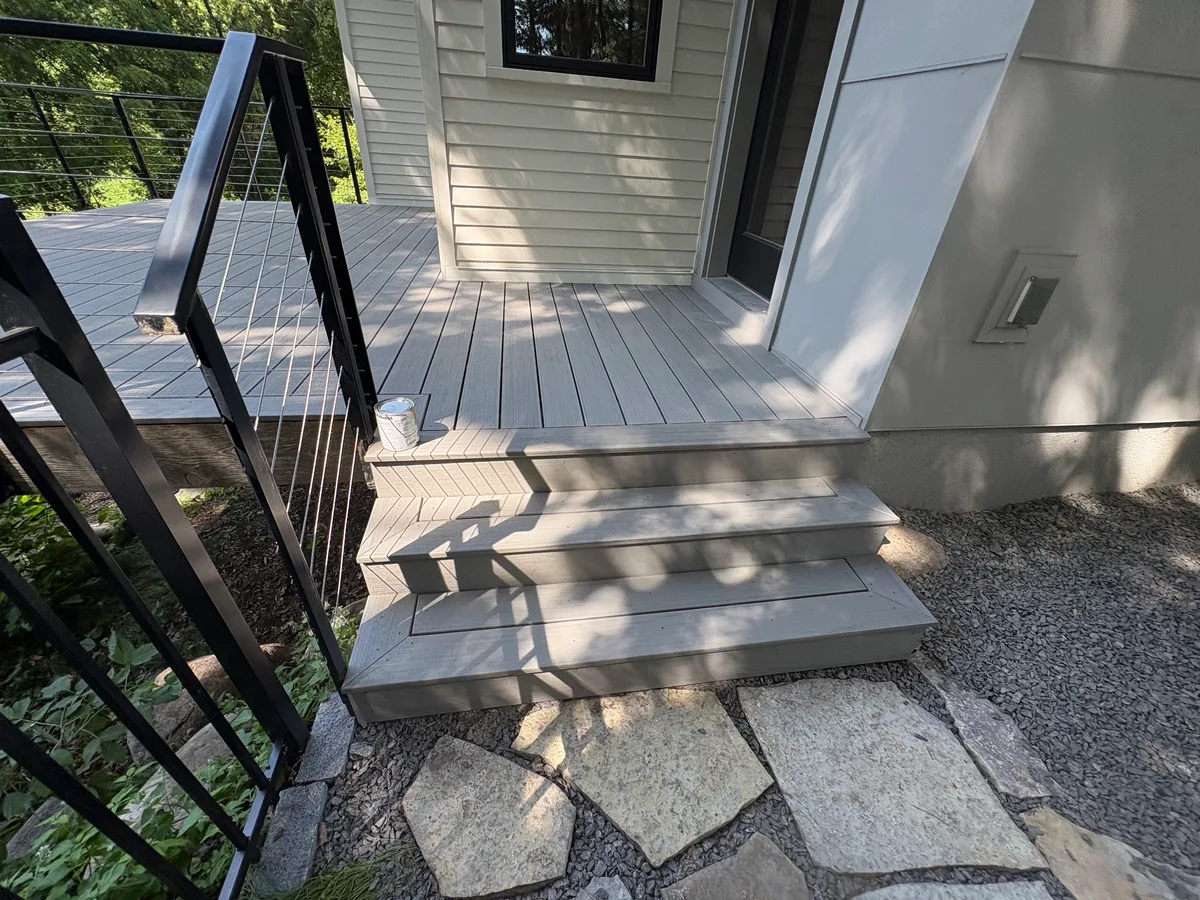 Hopkins composite deck stairs with gray decking and black cable railings