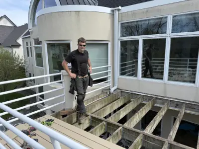 Danny standing on the exposed deck frame during the Hopkins resurfacing process