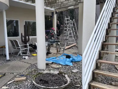 Process photo of the stair area and support posts during Hopkins deck work