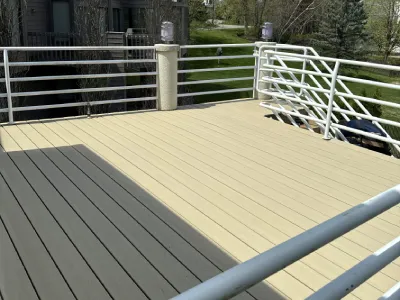 Completed Hopkins deck resurfacing project with new composite deck boards and white railings