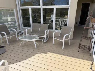 Completed Hopkins deck surface set up with patio furniture after resurfacing