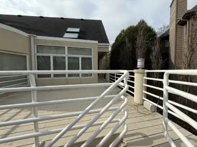 Before photo of the Hopkins deck walkway and railing layout before resurfacing
