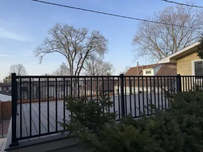 Open view across the composite garage deck surface with black aluminum railings