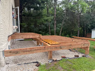Pressure-treated framing for a multi-level Minneapolis deck during construction