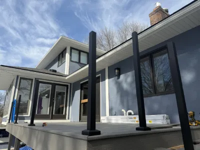 Deck railing posts installed on the resurfaced Minnetonka deck before final railing infill