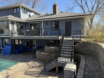 Finished elevated deck with new composite surface and rebuilt access stairs