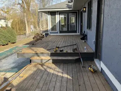 Old deck boards and stair area before demolition on a Minnetonka deck project