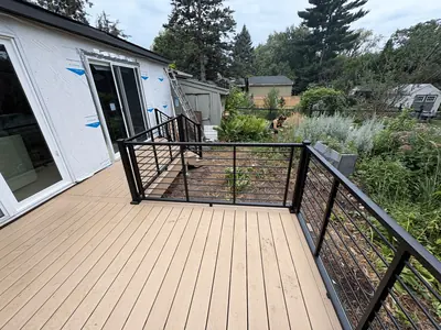 Minnetonka deck with picture-framed composite decking and black horizontal railings