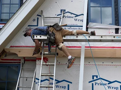 Brewer Built team member Brian Johnson working on exterior framing and house construction details in Minnetonka