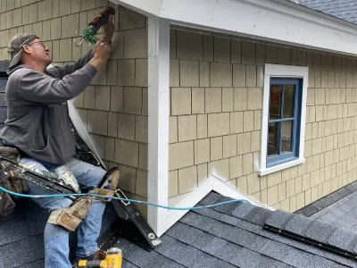 Exterior finish and trim installation on a custom home build in Minnetonka