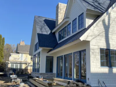 Wide exterior view of a near-complete Minnetonka house construction project