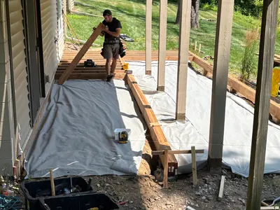 Framing installation beneath existing elevated deck in Minnetonka