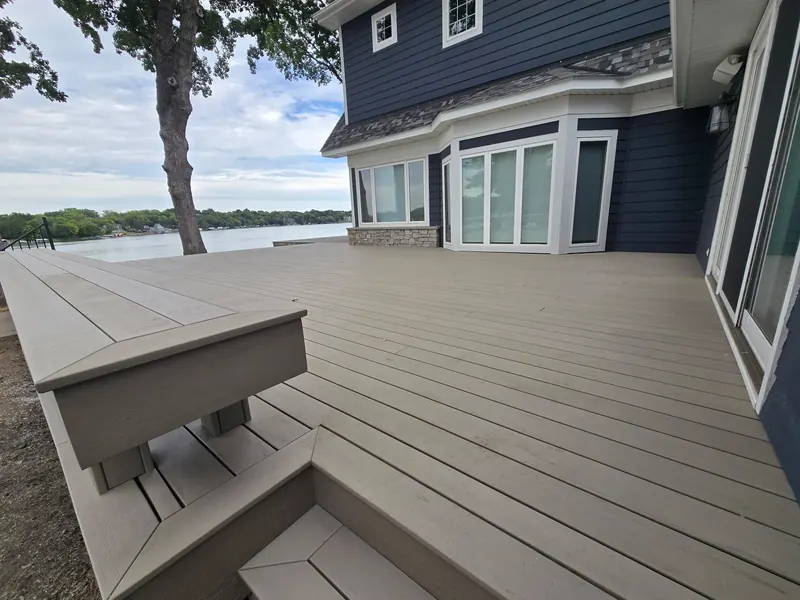 Open composite deck surface beside a Minnetrista lake home