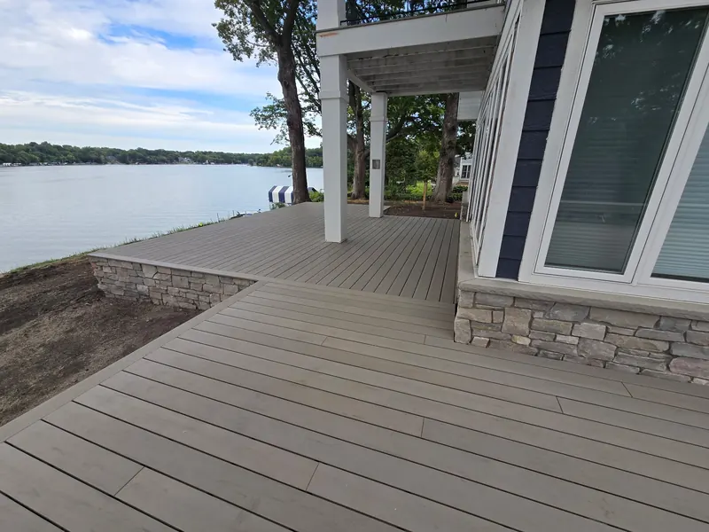 Covered section of a Minnetrista composite deck overlooking the lake