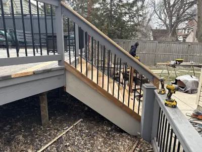 Side view of rebuilt deck stairs and railing work in St. Louis Park