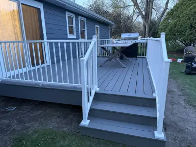 White deck railing surrounding a finished composite deck in Wayzata