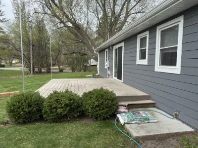 Older deck surface near sliding door before Wayzata deck resurfacing project