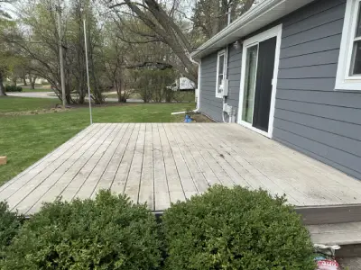 Composite deck boards being installed on a Wayzata deck resurfacing project