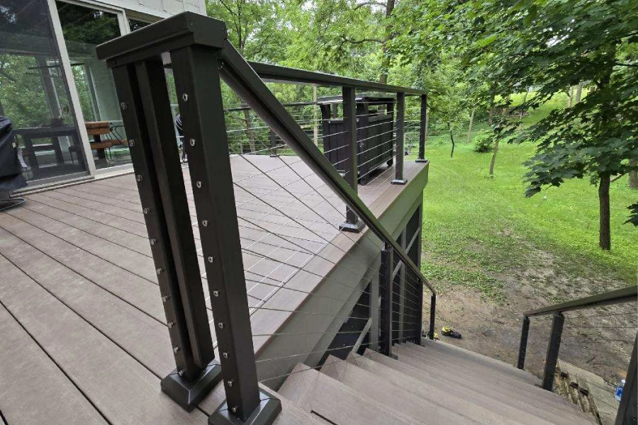 Black aluminum railing installed on a raised deck