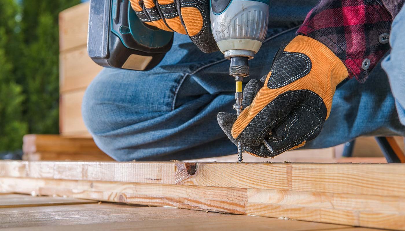 carpenter using drill driver in woodworking 2021 08 28 12 05 32 utc